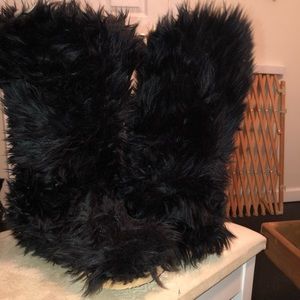 Black furry boots.